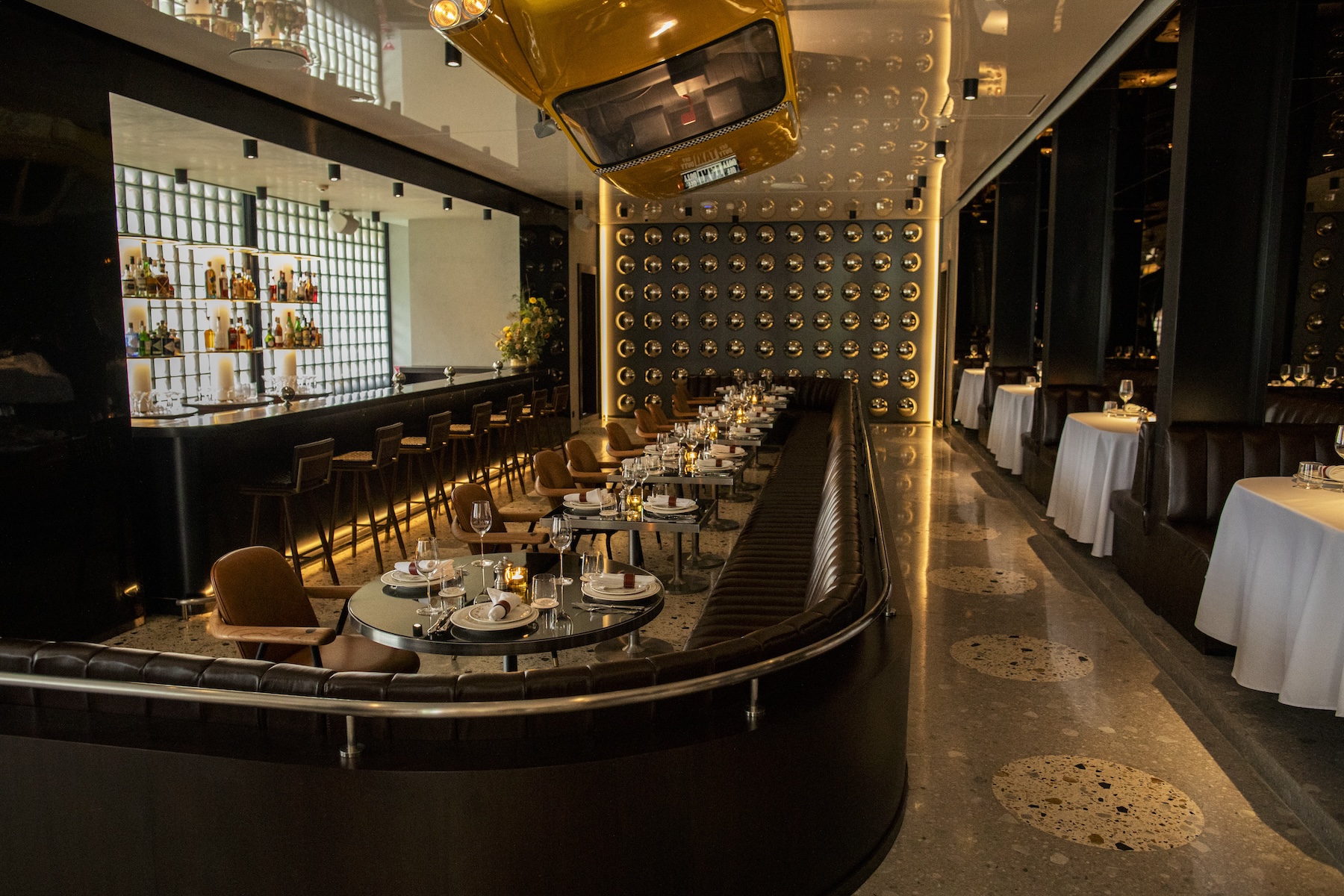 The Coach restaurant dining room and bar, the first-ever Coach restaurant, now open in Jakarta, Indonesia. (Photo: Coach)